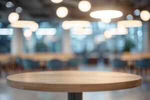 A large, empty office room with a sun shining through the windows. Modern space is made of glass and has a shiny, reflective surface photo