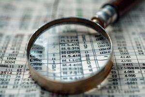 Audit internal financial advice investigation accounting glasses calculator on paper paperwork archive pile of documents analytics data analysis research numbers statistics confidential photo