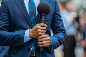 Businessperson politician interview on street political advertisement ad campaign upcoming elections cameras recording microphones ask questions journalists media coverage reporters live photo