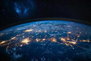 A view of the Earth from space, with a bright blue planet surrounded by a dark sky. The stars are scattered throughout the sky, creating a sense of vastness and wonder photo