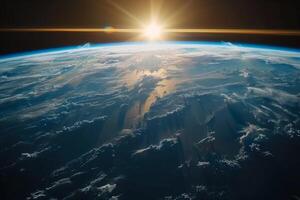 A view of the Earth from space, with a bright blue planet surrounded by a dark sky. The stars are scattered throughout the sky, creating a sense of vastness and wonder photo