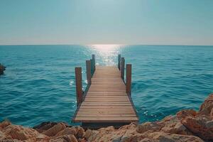 A wooden pier with a blue and white color scheme. The pier is located in the ocean and is surrounded by water. The image has a calm and peaceful mood, as it captures the beauty of the photo