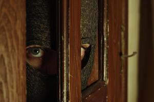 Burglar thief robbing house criminal activity robbery burglary mask crime scene stealing mugger security risk cctv camera catch illegal activity dangerous evil violence gun balaclava photo