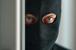 Burglar thief robbing house criminal activity robbery burglary mask crime scene stealing mugger security risk cctv camera catch illegal activity dangerous evil violence gun balaclava photo