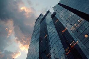 Modern office building windows lit in evening night early morning long working hours exhaustion overtime exterior urban architecture skyscraper lights tower financial sector banking hq photo