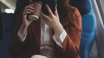 Woman using mobile phone in plane cabin video