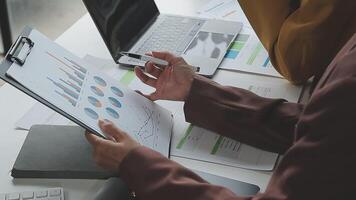 Team of business people working together in the meeting room office, teamwork background charts and graphs banner, double exposure successful teamwork,business planning concept. video