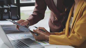 Team of business people working together in the meeting room office, teamwork background charts and graphs banner, double exposure successful teamwork,business planning concept. video