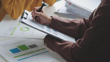 Team of business people working together in the meeting room office, teamwork background charts and graphs banner, double exposure successful teamwork,business planning concept. video