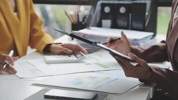 Team of business people working together in the meeting room office, teamwork background charts and graphs banner, double exposure successful teamwork,business planning concept. video