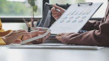 Team of business people working together in the meeting room office, teamwork background charts and graphs banner, double exposure successful teamwork,business planning concept. video