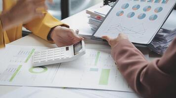 Team of business people working together in the meeting room office, teamwork background charts and graphs banner, double exposure successful teamwork,business planning concept. video