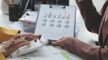 Team of business people working together in the meeting room office, teamwork background charts and graphs banner, double exposure successful teamwork,business planning concept. video