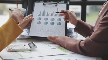 Team of business people working together in the meeting room office, teamwork background charts and graphs banner, double exposure successful teamwork,business planning concept. video