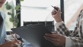 Team of business people working together in the meeting room office, teamwork background charts and graphs banner, double exposure successful teamwork,business planning concept. video