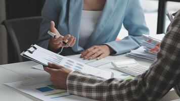 Team of business people working together in the meeting room office, teamwork background charts and graphs banner, double exposure successful teamwork,business planning concept. video