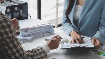 Team of business people working together in the meeting room office, teamwork background charts and graphs banner, double exposure successful teamwork,business planning concept. video