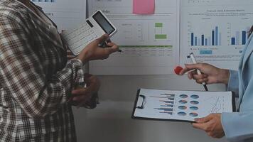 Team of business people working together in the meeting room office, teamwork background charts and graphs banner, double exposure successful teamwork,business planning concept. video