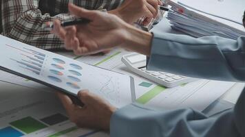 Team of business people working together in the meeting room office, teamwork background charts and graphs banner, double exposure successful teamwork,business planning concept. video