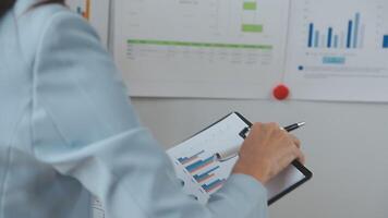 Team of business people working together in the meeting room office, teamwork background charts and graphs banner, double exposure successful teamwork,business planning concept. video