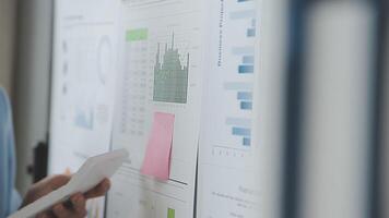 Team of business people working together in the meeting room office, teamwork background charts and graphs banner, double exposure successful teamwork,business planning concept. video