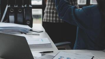 Team of business people working together in the meeting room office, teamwork background charts and graphs banner, double exposure successful teamwork,business planning concept. video