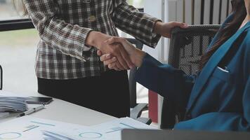 Team of business people working together in the meeting room office, teamwork background charts and graphs banner, double exposure successful teamwork,business planning concept. video
