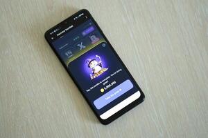 KYIV, UKRAINE - APRIL 20, 2024 Hamster Kombat telegram bot on smartphone screen. Hamster Kombat is a viral Telegram crypto game for earn HMSTR tokens by managing virtual crypto exchange photo