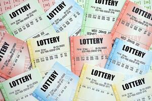 Many lottery tickets on blank bills with numbers for playing lottery photo
