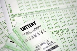 Green lottery tickets and blank bills with numbers for playing lottery photo