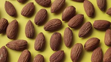 Almond nut on yellow background video