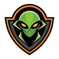 A green alien head is featured in a shield shaped emblem. The alien is wearing a black and white mask. The shield has an orange and black border. vector