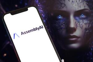 KYIV, UKRAINE - MARCH 17, 2024 AssemblyAI logo on iPhone display screen with background of artificial intelligence futuristic image photo