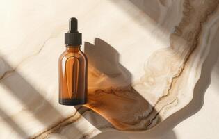 Glass Dropper Bottle With Golden Liquid on a Neutral Backdrop in Soft Natural Light photo