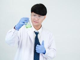Portrait asian man student scientist or doctor look hand holding reagent mixing laboratory in science research laboratory with test tubes of various size in laboratory chemistry lab white background photo