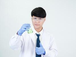 Portrait asian man student scientist or doctor look hand holding reagent mixing laboratory in science research laboratory with test tubes of various size in laboratory chemistry lab white background photo