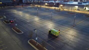There is an ambulance waiting for the next job to be assigned to it. Aerial view of an ambulance standing in the parking lot, waiting for a call to come, from an aerial perspective. video