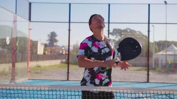 Caucasian Person Warms Up With Padel Racket And Ball video