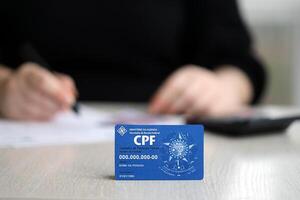 KYIV, UKRAINE - OCTOBER 31, 2023 Blue CPF card document template. The document guarantees authenticity and integrity in electronic communication between people in Brazil photo