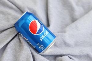 KYIV, UKRAINE - 4 MAY, 2023 Pepsi Classic in small can produced by PepsiCo Inc photo