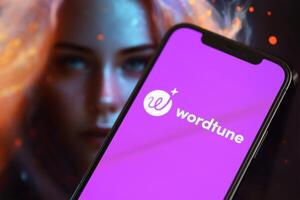 KYIV, UKRAINE - MARCH 17, 2024 Wordtune logo on iPhone display screen with background of artificial intelligence futuristic image photo