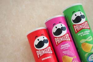 KYIV, UKRAINE - 4 MAY, 2023 Many pringles tubes of chips with various flavours photo
