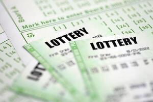 Green lottery tickets and blank bills with numbers for playing lottery photo