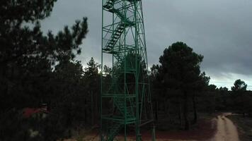 Aerial view of a watchtower between mountains. video
