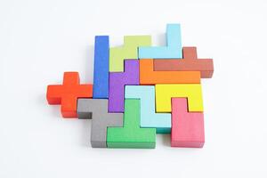 Logical thinking and problem solving problem solution creative business concept, wooden puzzle geometric block shape. photo