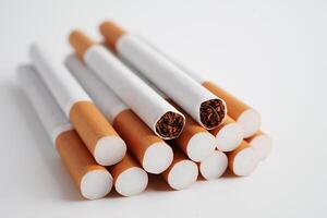 Cigarette, roll tobacco in paper with filter tube, No smoking concept. photo