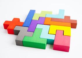 Logical thinking and problem solving problem solution creative business concept, wooden puzzle geometric block shape. photo