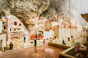 Ayder, Turkey - 12th september, 2021 - Ancient religious paintings on interior walls of famous Sumela Monastery with tourist walk and sightseeing photo