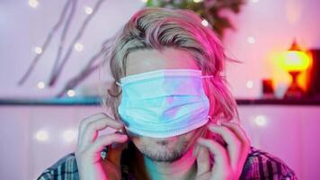 Guy unsuccessfully puts a protective mask right over his eyes, but then corrects it video