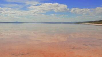 Panoramic view of calm salt lake with clouds reflected in water Salt lake stretches across horizon, creating mirror-like effect. Salt lake's serene surface captures beauty of nature in Ankara, Turkey video